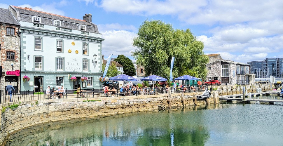 The Three Crowns pub on the Barbican with outdoor seating